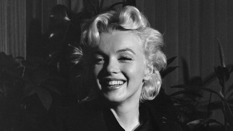 Actress Marilyn Monroe smiling at press conference