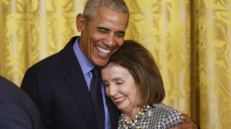 Nancy Pelosi and Barack Obama embrace