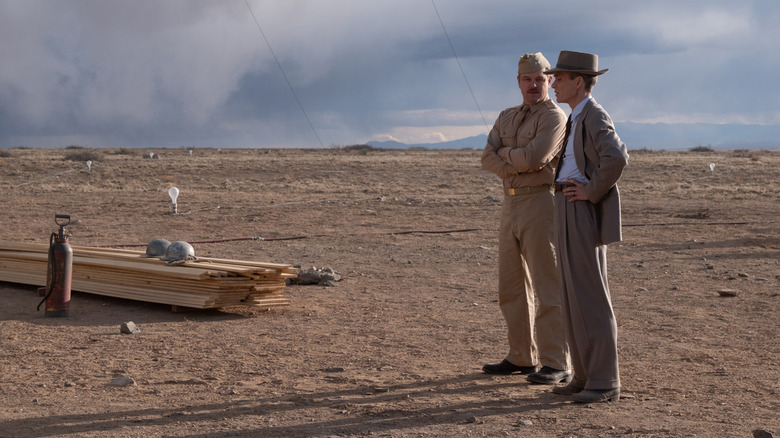Leslie Groves and Oppenheimer standing in desert