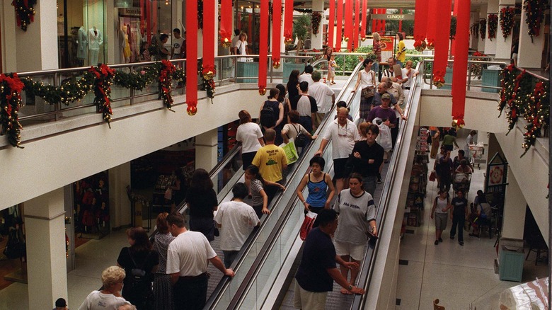 shoppers in a mall christmas decorations