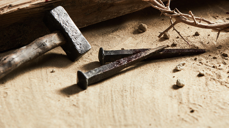 close-up iron nails and hammer