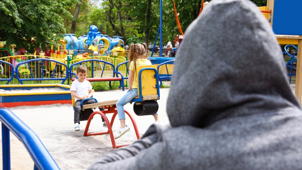 Man watching children at playground