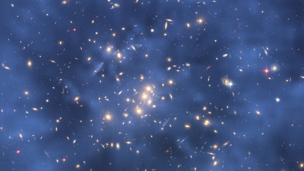  This Hubble Space Telescope composite image shows a ghostly "ring" of dark matter in the galaxy cluster ZwCl0024+1652.