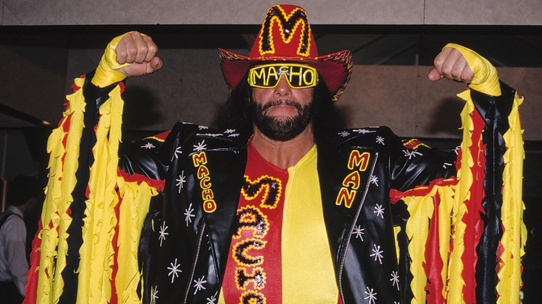 Randy Savage flexing at a convention