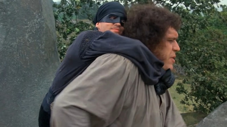 Cary Elwes' Westley hanging on the back of Andre the Giant's Fezzik in The Princess Bride