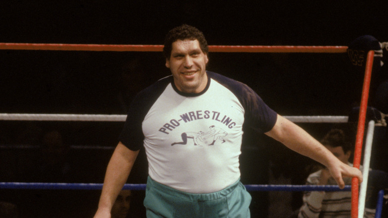 A smiling Andre the Giant walking in the ring