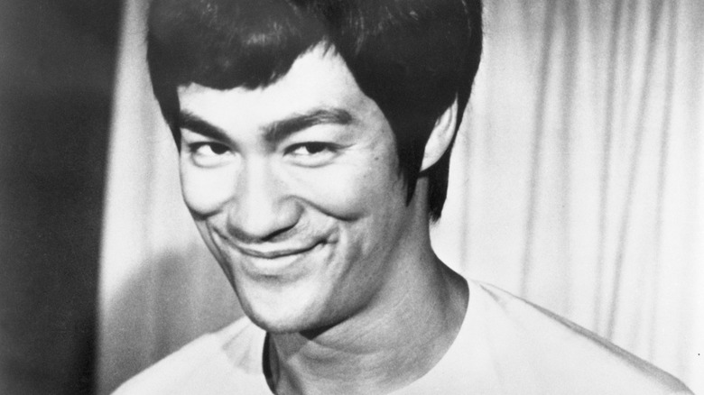 Bruce Lee giving the camera a huge smirk