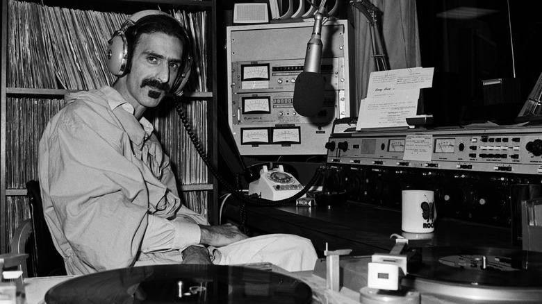 Frank Zappa sitting in a DJ booth