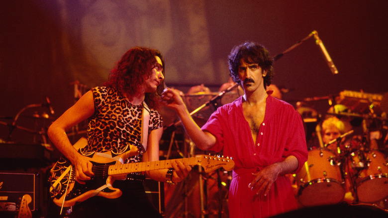 Frank Zappa and Steve Vai performing