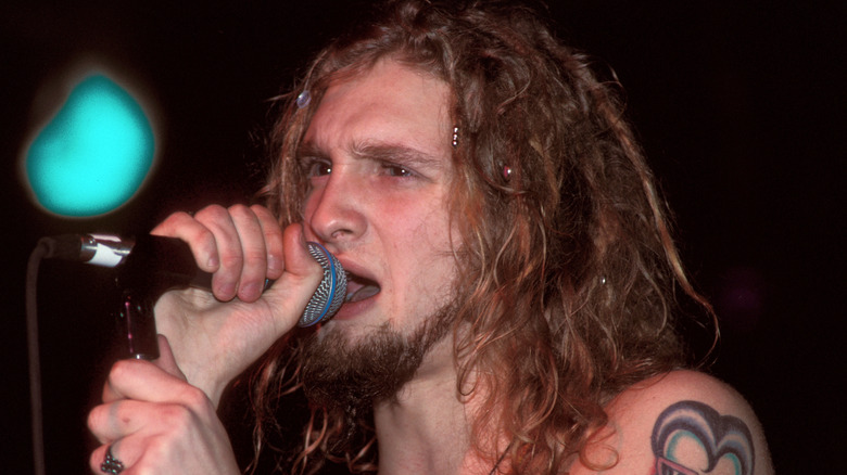 layne staley singing with long hair and shirtless