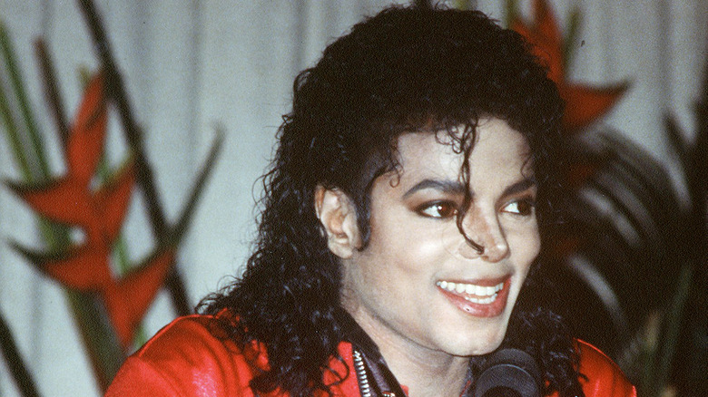 Michael Jackson smiling in red outfit