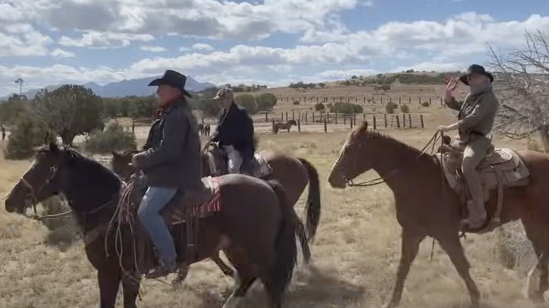 men on horses on set of rust from last take documentary