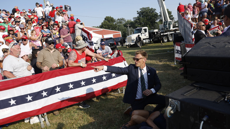 officials at Trump rally with crowds