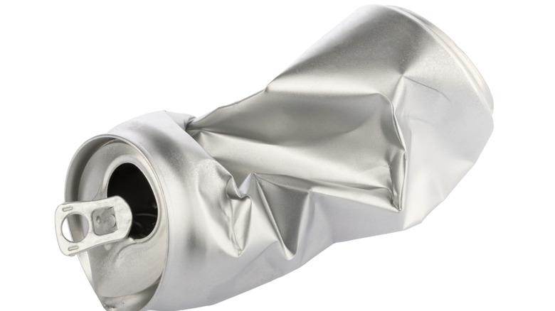 crumpled aluminum soda can