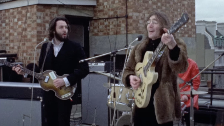 paul mccartney john lennon playing on rooftop