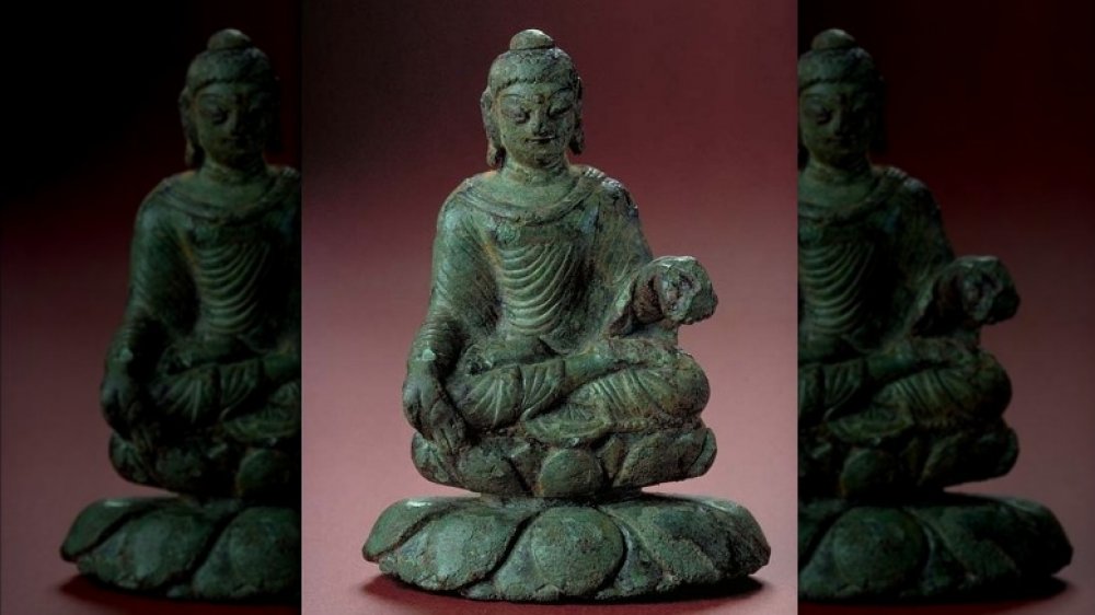 Photograph of the Helgö Buddha at the Statens historiska museum