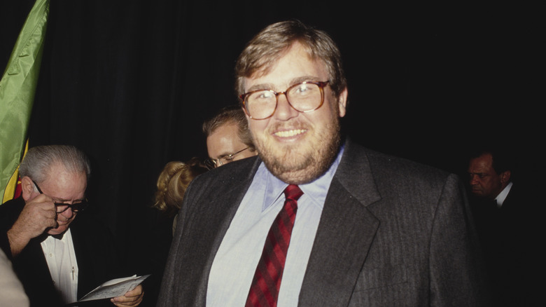 John Candy smiling in glasses