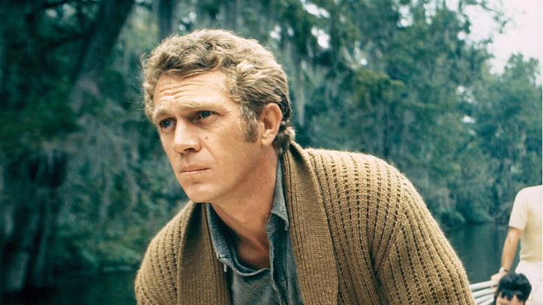 Steve McQueen in cardigan on boat