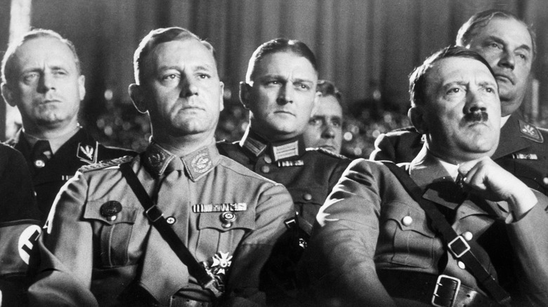 Hitler seated in audience with Nazis