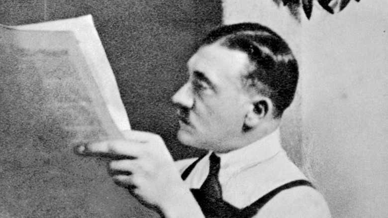 Adolf Hitler reading newspaper