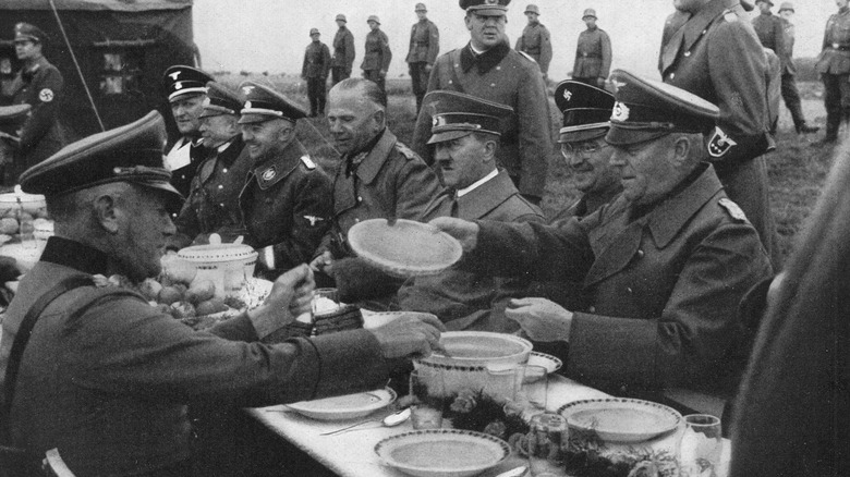 Hitler dining outdoors with generals