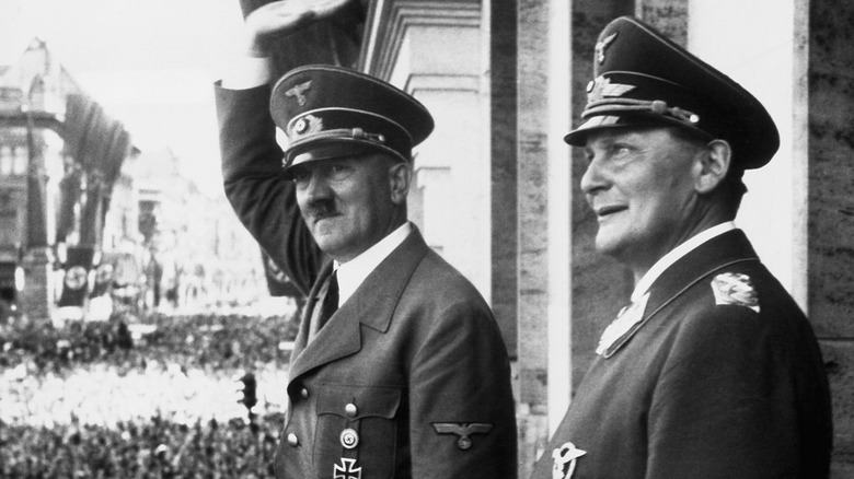 Hitler on balcony saluting rally