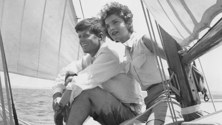 jfk and jackie kennedy sitting smiling on boat