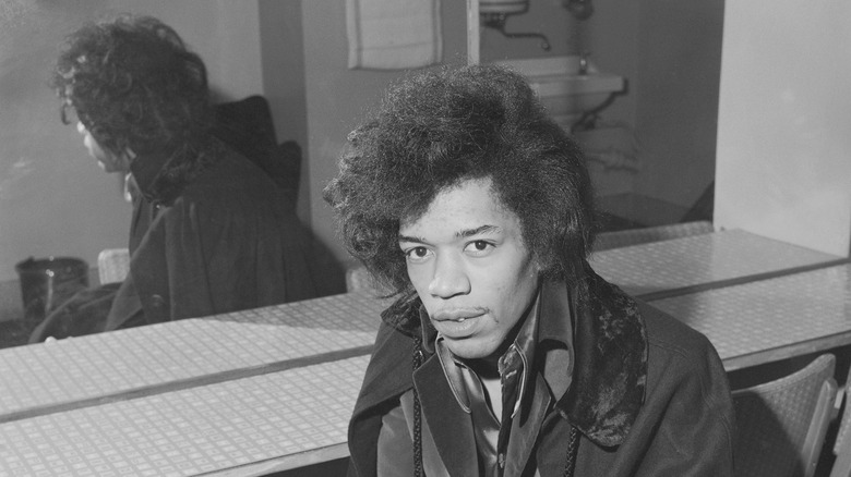 Jimi Hendrix in dressing room chair