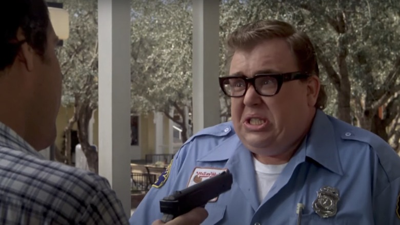 John Candy glasses police uniform film still