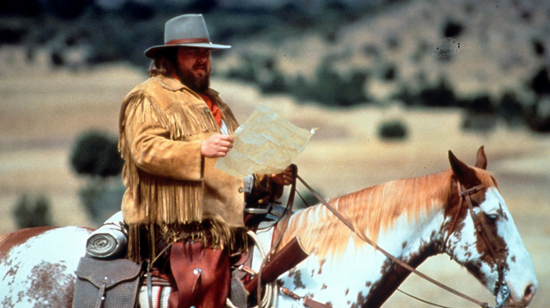 John Candy on horse Wagons East scene