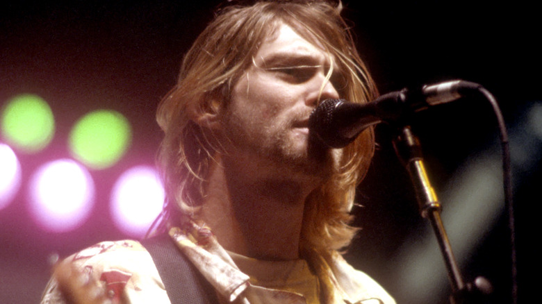 Kurt Cobain performing on stage