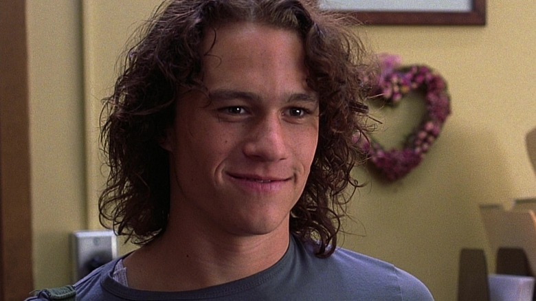 Heath Ledger as Patrick Verona indoors blue shirt smiling