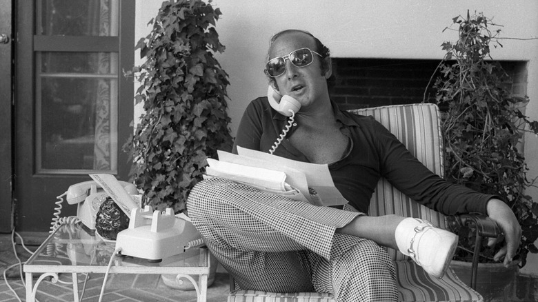 Record executive Clive Davis talking on a phone in the 1970s