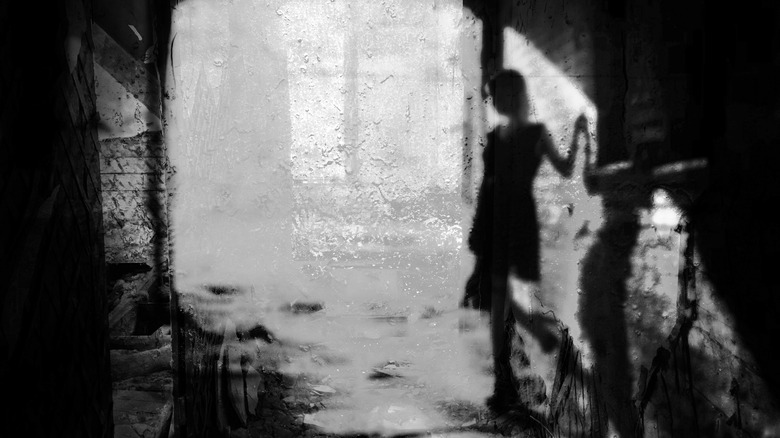 Woman abandoned house blur