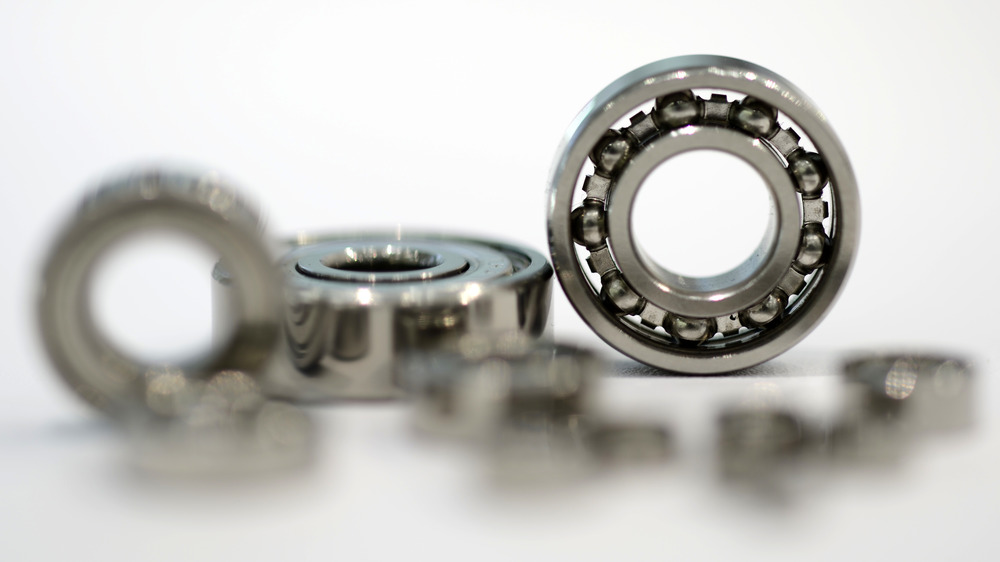 Encased ball bearings against white backdrop