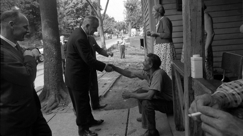 President Lyndon B. Johnson shakes the hand of Appalachian man, 1964