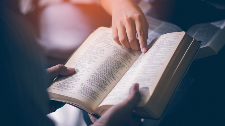 hands with a bible