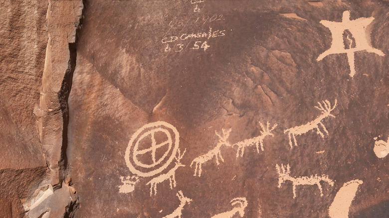 Prehistoric carvings with modern graffiti 