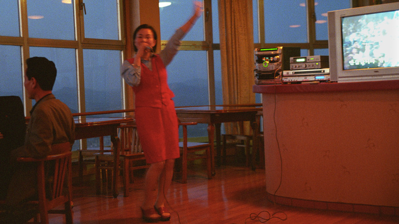 A woman performing karaoke in Pyongyang