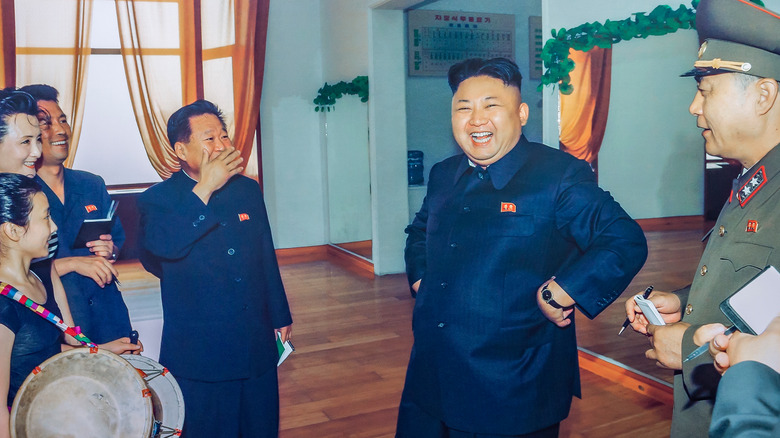 Kim Jong-un laughing at a school