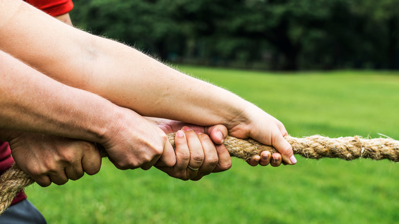 People competing in tug-of-war