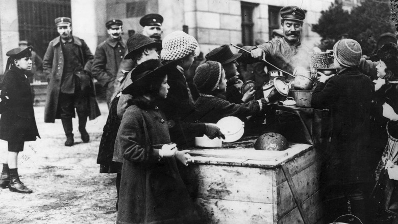 children at a street soup kitchen