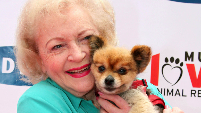 betty white holding a pooch (not Pontiac)