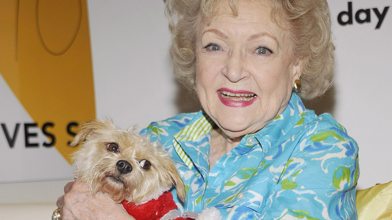 Betty White holding a dog