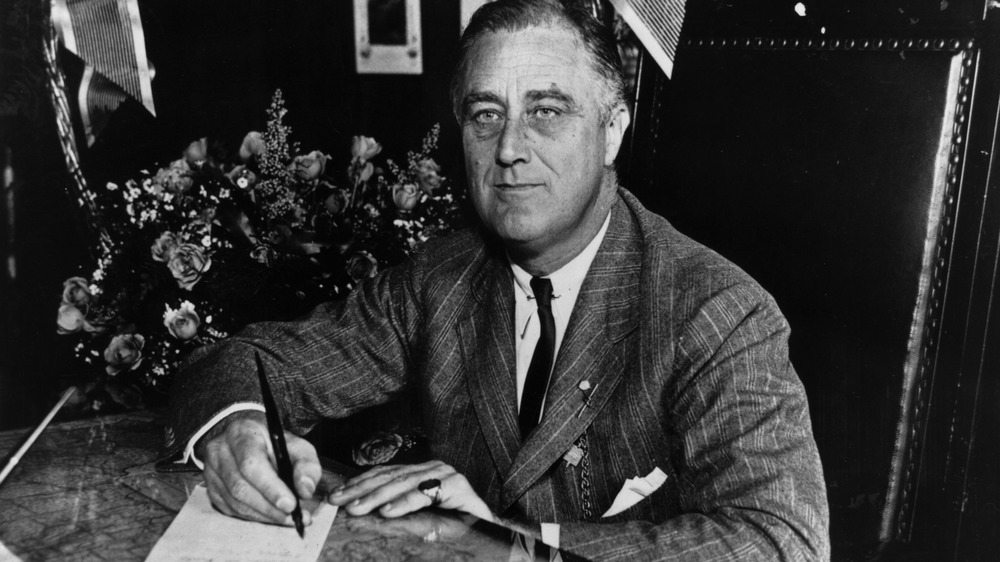 Franklin D. Roosevelt with pen