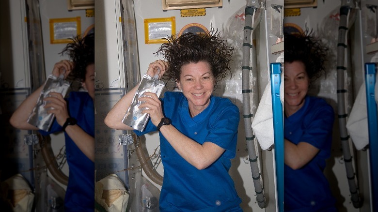 NASA astronaut Catherine Coleman washes her hair aboard the International Space Station.
