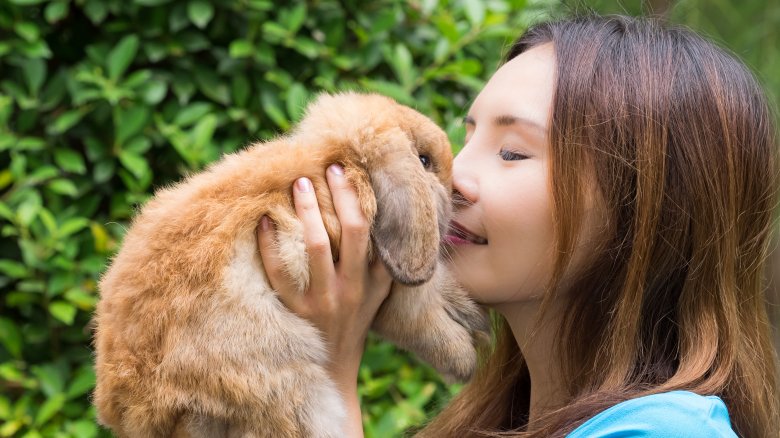 Woman with pet rabbit