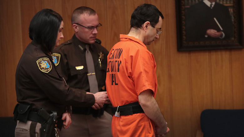 Larry Nassar in handcuffs