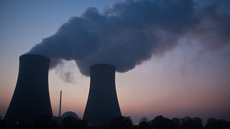 silhouetted nuclear plant cooling towers