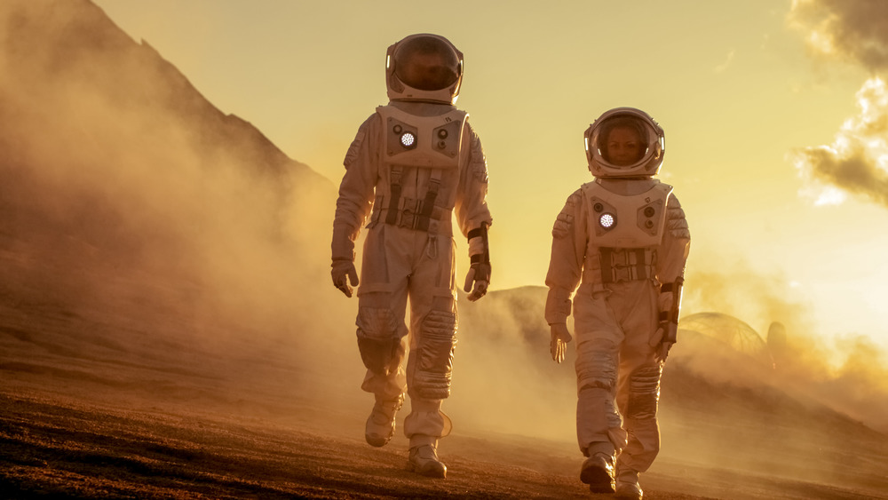 astronauts walking on Mars